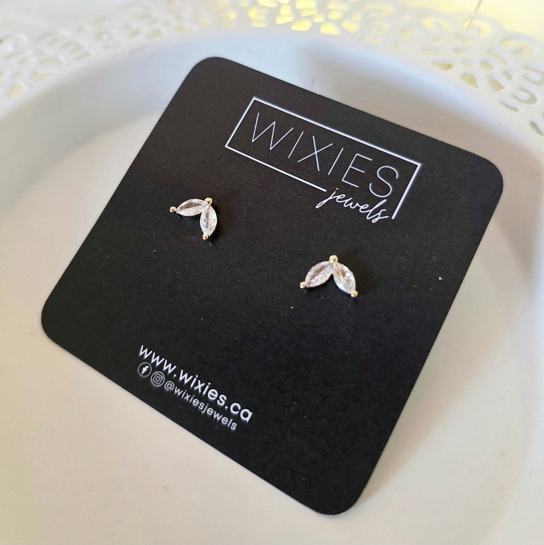 Two Leaf Studs with cubic zirconia leaves on 18k gold plated brass posts displayed on Wixies black card