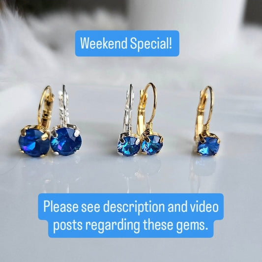 Weekend Special Wixies earrings with milky blue gems in mixed metal settings reflecting unique faceted shine on white surface