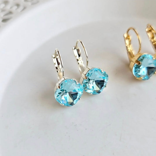 Tahiti Blue Cushion Lever Back earrings by Wixies with bright blue stones in silver settings Handmade and Picked in Nova Scotia