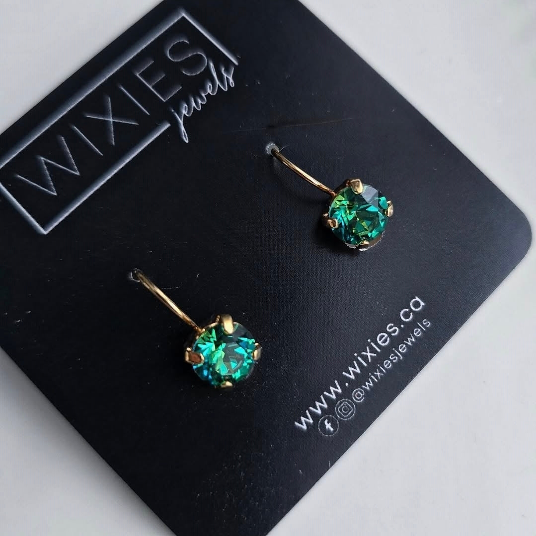Wixies *Limited Edition* Green Colour Shift Lever Back earrings with deep green shifting stones in gold settings on black card