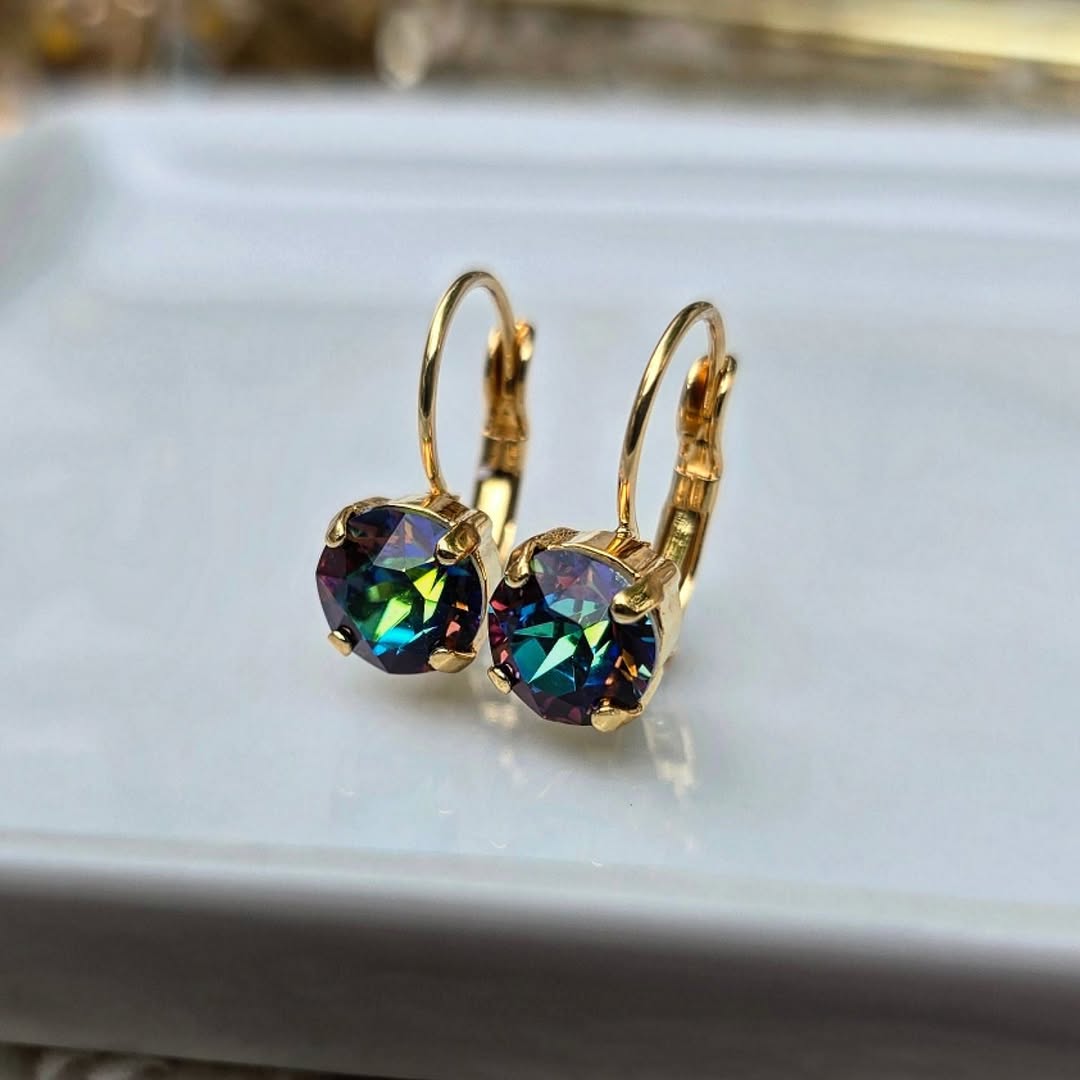 Aurora" 8mm Lever Back earrings with multicolored gems set in gold plated brass by Wixies on white surface