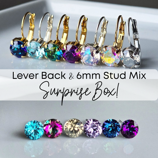 Colorful lever back and 6mm stud earrings mix on a light gray background with a text "lever back and 6 millimeter stud mix surprise box."