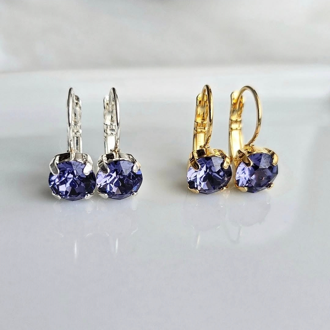 8mm or 6mm Indigo Violet Lever Back by wixies featuring violet stones set in silver and gold lever back earrings on reflective surface