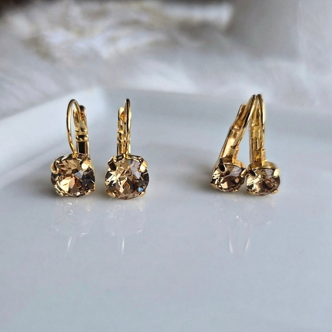 Wixies Light Topaz 8mm or 6mm Lever Back earrings with warm golden stones in gold plated brass settings on white surface