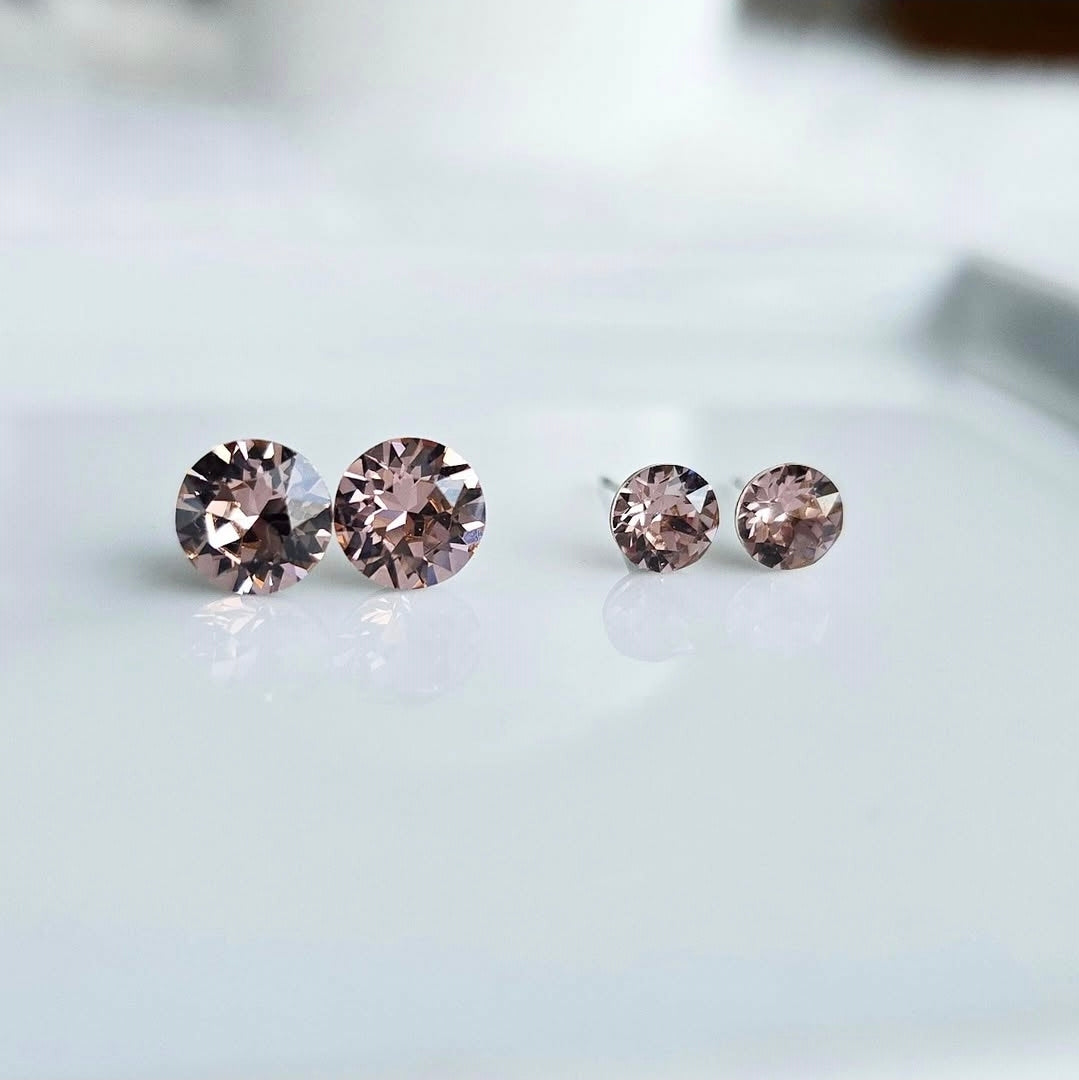 8mm or 6mm Vintage Pink Studs by wixies displaying faceted pink stones on silver posts on smooth white surface