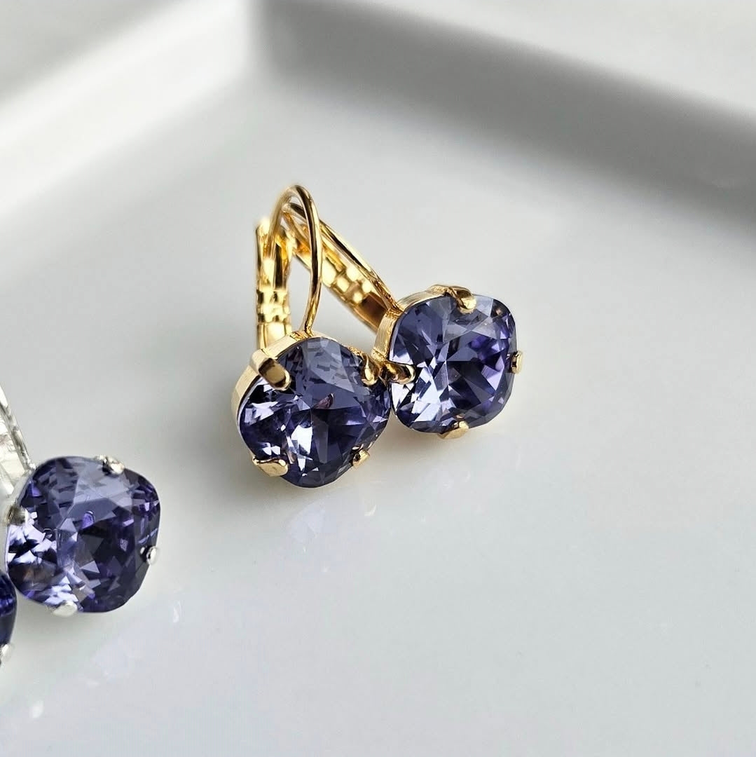 Indigo Violet Cushion Cut Lever Back by wixies featuring gold lever backs with violet cushion stones on white background