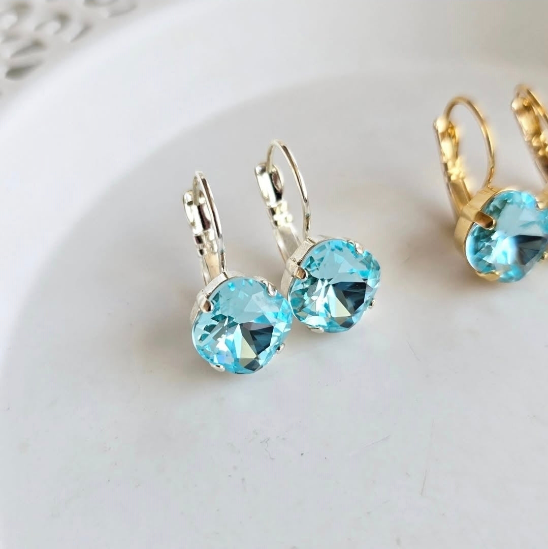 Tahiti Blue Cushion Lever Back earrings by Wixies with bright blue stones in silver settings Handmade and Picked in Nova Scotia