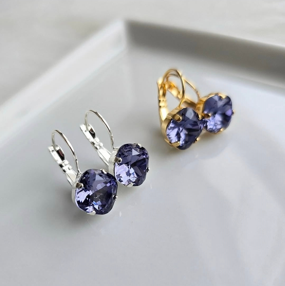 Indigo Violet Cushion Cut Lever Back earrings by wixies showcasing cushion cut violet stones in silver and gold settings on white tray