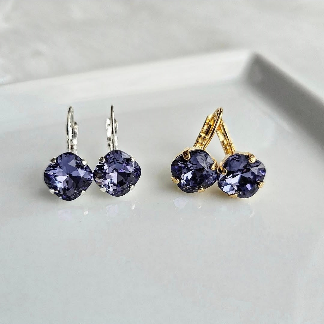 Indigo Violet Cushion Cut Lever Back by wixies with cushion cut violet stones in silver and gold settings on white surface