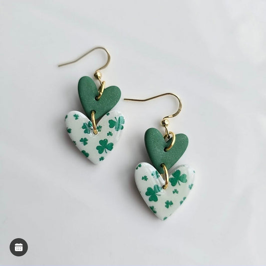 Lovely Clover Dangles by wixies featuring green and white heart shapes with clover pattern and gold hooks on white background