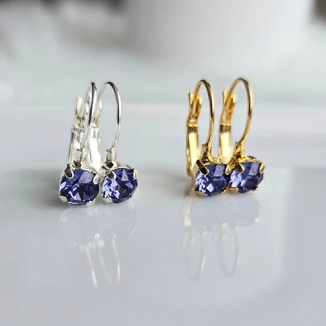 8mm or 6mm Indigo Violet Lever Back by wixies with violet stones set in silver and gold hooks on reflective white surface