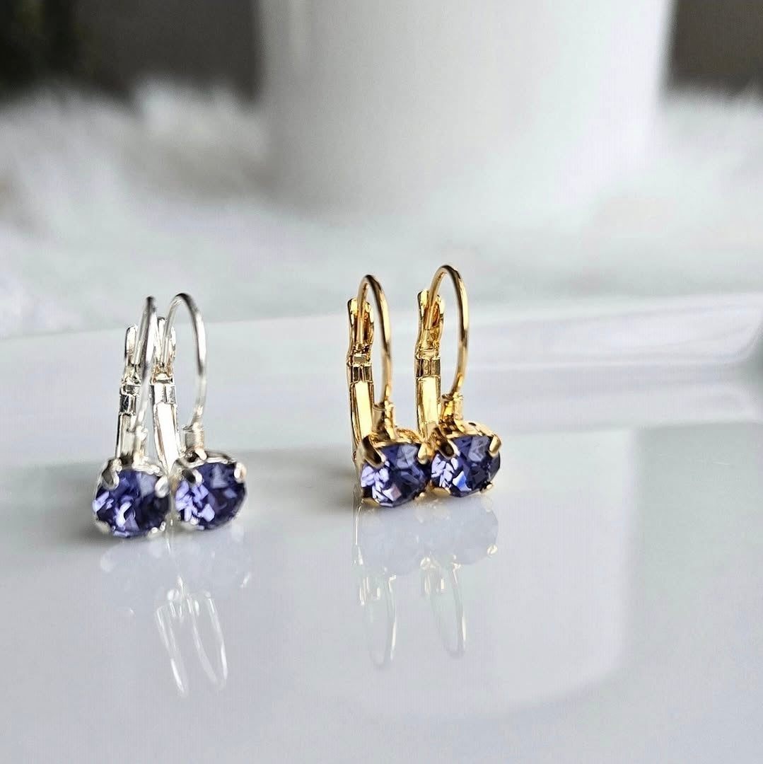 8mm or 6mm Indigo Violet Lever Back by wixies showing violet stones set in silver and gold hooks on reflective surface